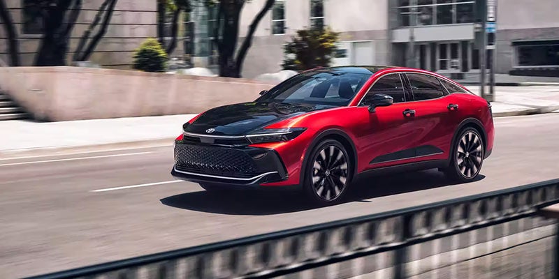 A 2024 Toyota Crown driving now a city street in Akron, OH