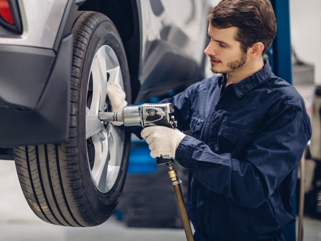 A Toyota service technician keeping up your Toyota maintenance by doing an expert wheel alignment in Akron, OH