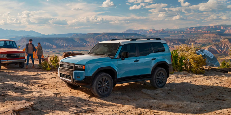 A family out camping with their 2025 Toyota Land Cruiser from Akron, OH