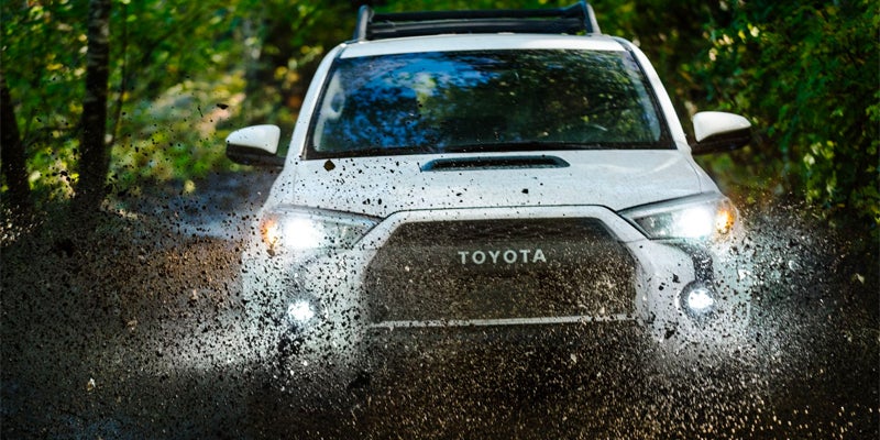 A 2024 Toyota 4Runner that is using its engine to power through muddy conditions in Akron, OH