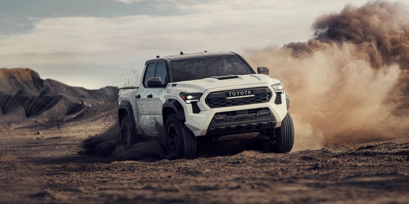 A 2024 Toyota Tacoma kicking up dust in Akron, OH
